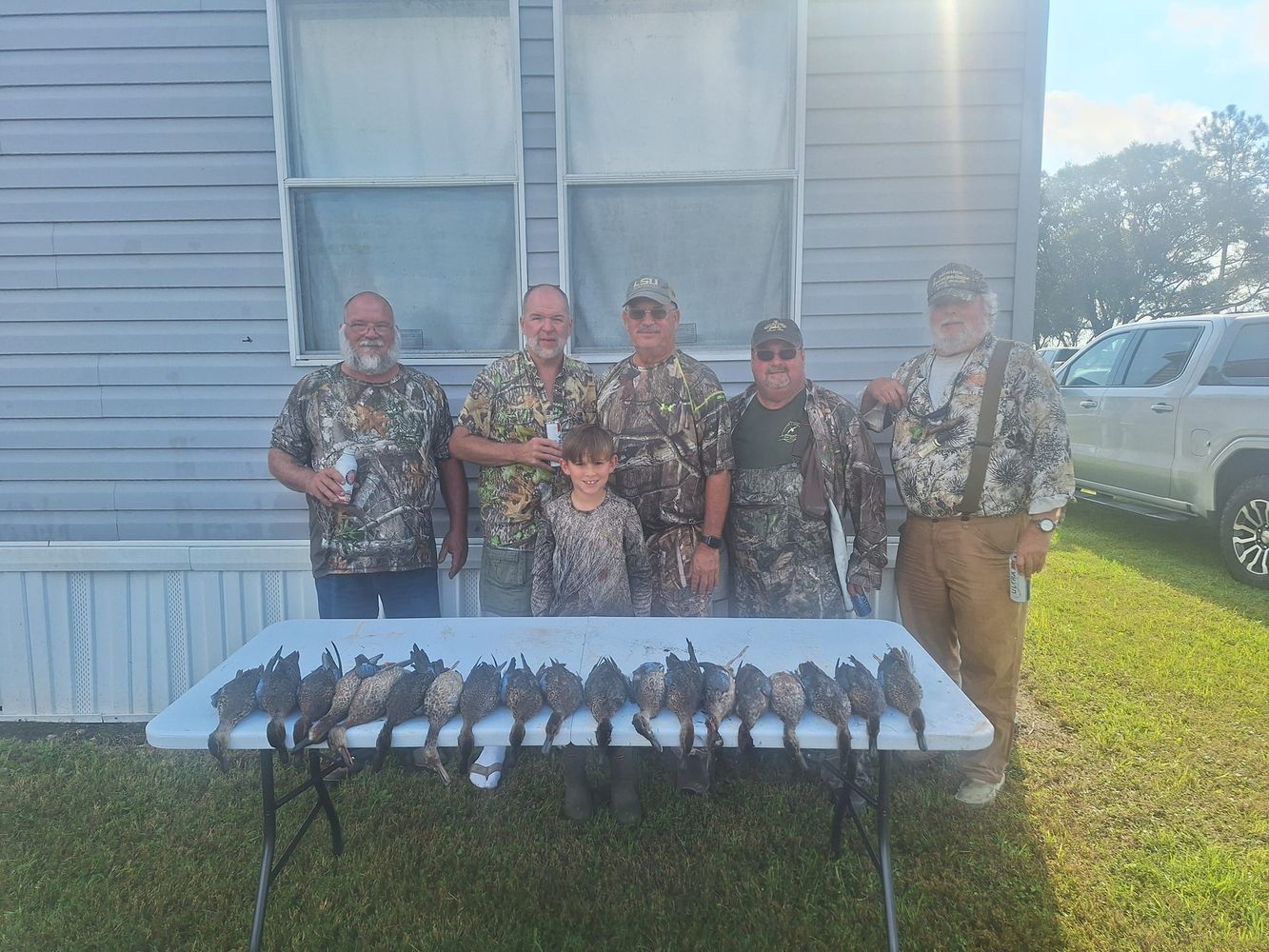 Group with a table of South Louisiana teal